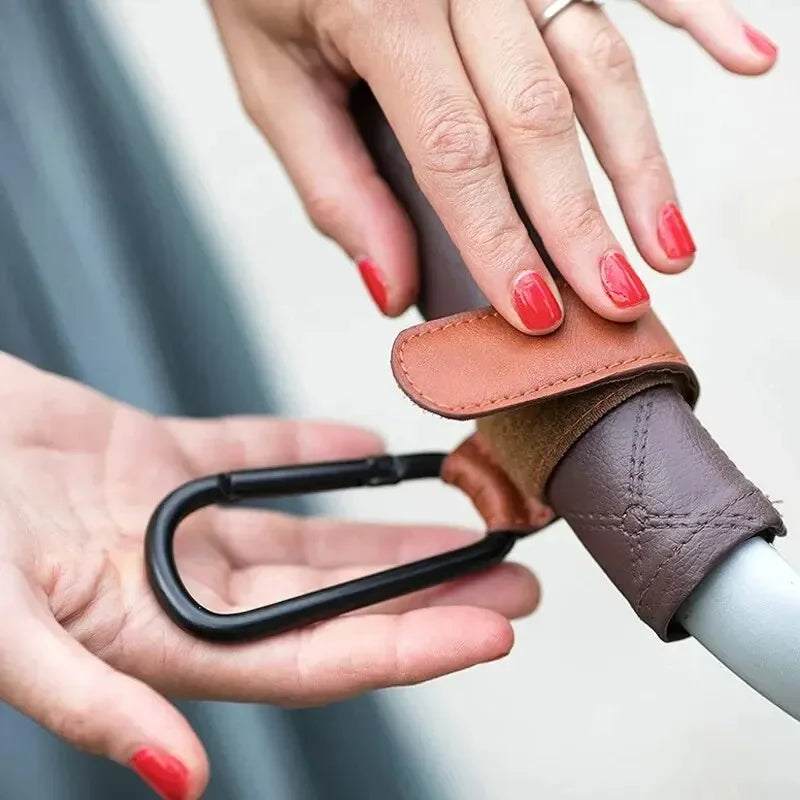 Stroller Hook Straps – Durable PU Leather with Velcro, Holds Up to 10lbs | Multi-Purpose Hook for Strollers, Bicycles, Shopping Carts, and More | Available in Black, Brown, Light Blue, Pink